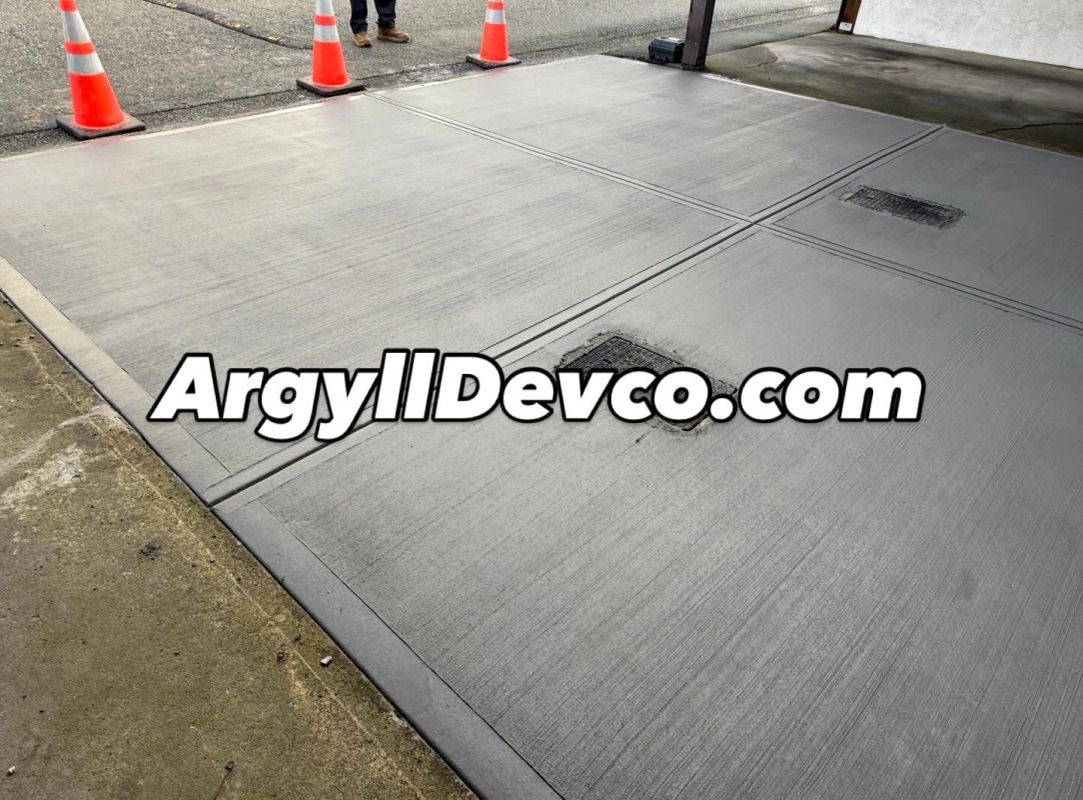Finished concrete surface with integrated drainage
